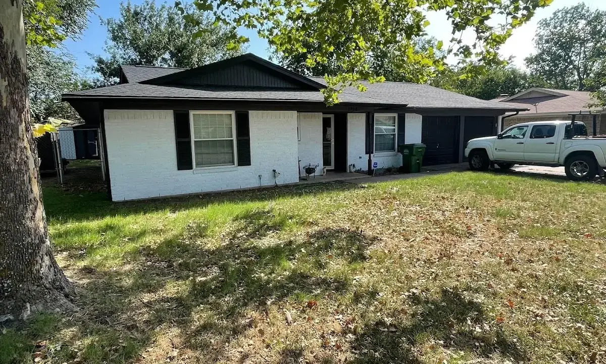 Professional roofing crew working on a residential roof in Fremont